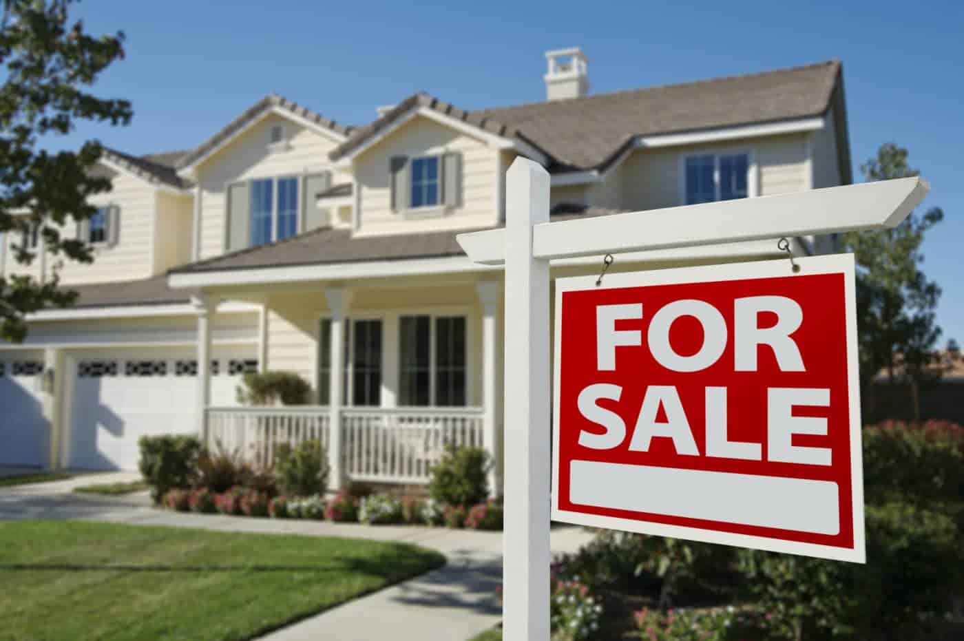 A house with a for sale sign in front, indicating the need for repairs before listing.