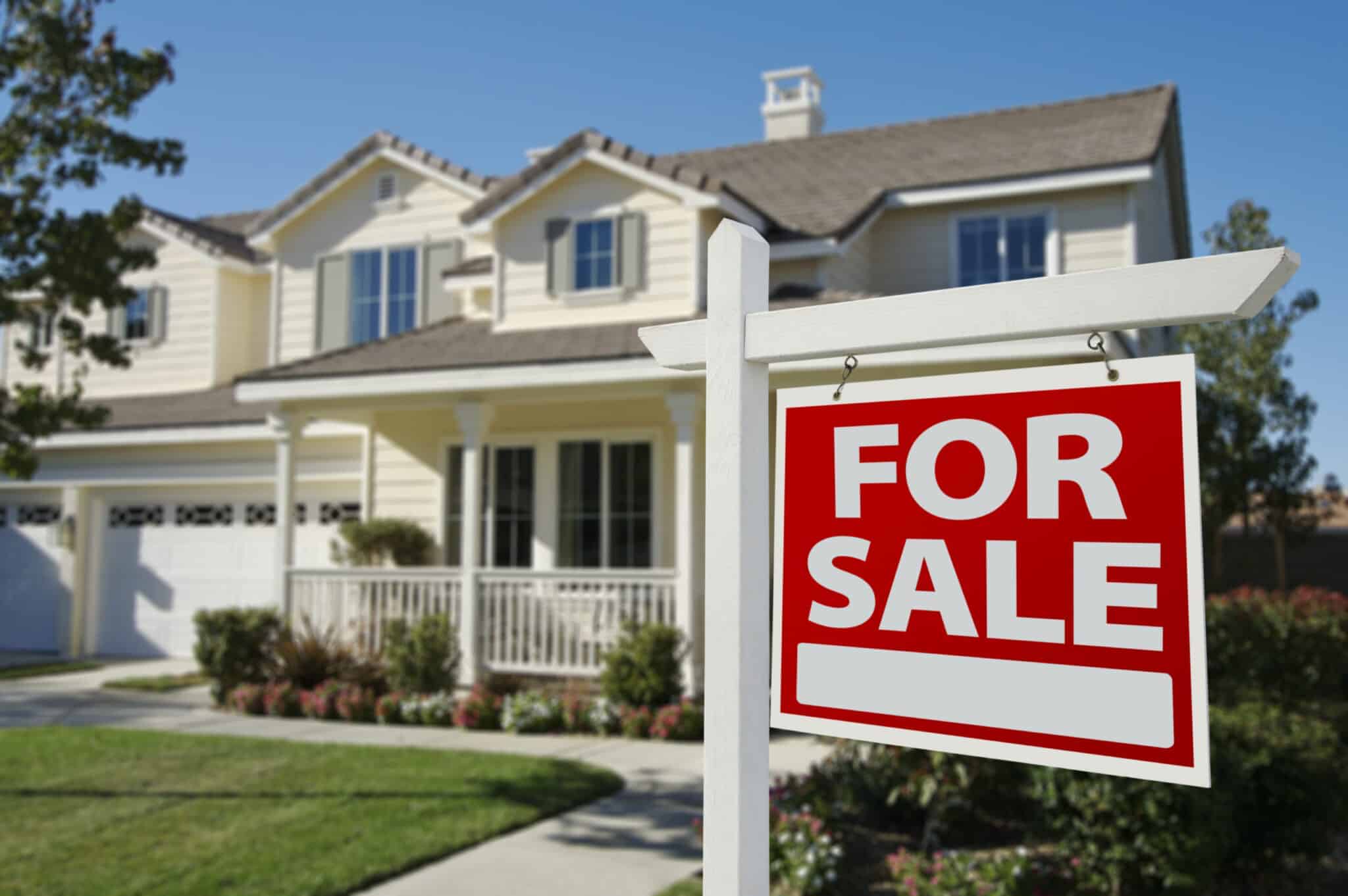 A house with a for sale sign in front, indicating the need for repairs before listing.