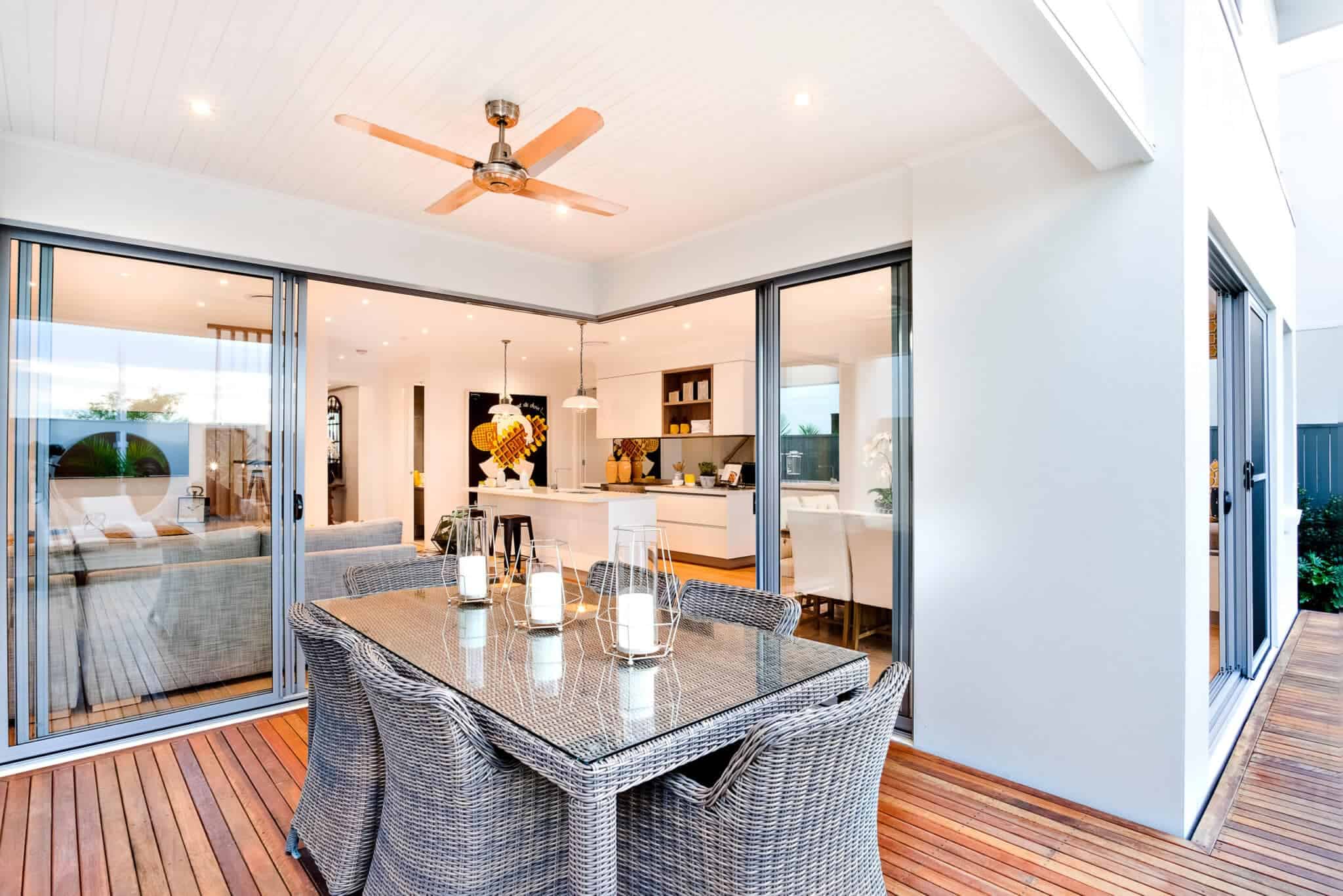 A modern home with a patio door, dining table, and chairs.