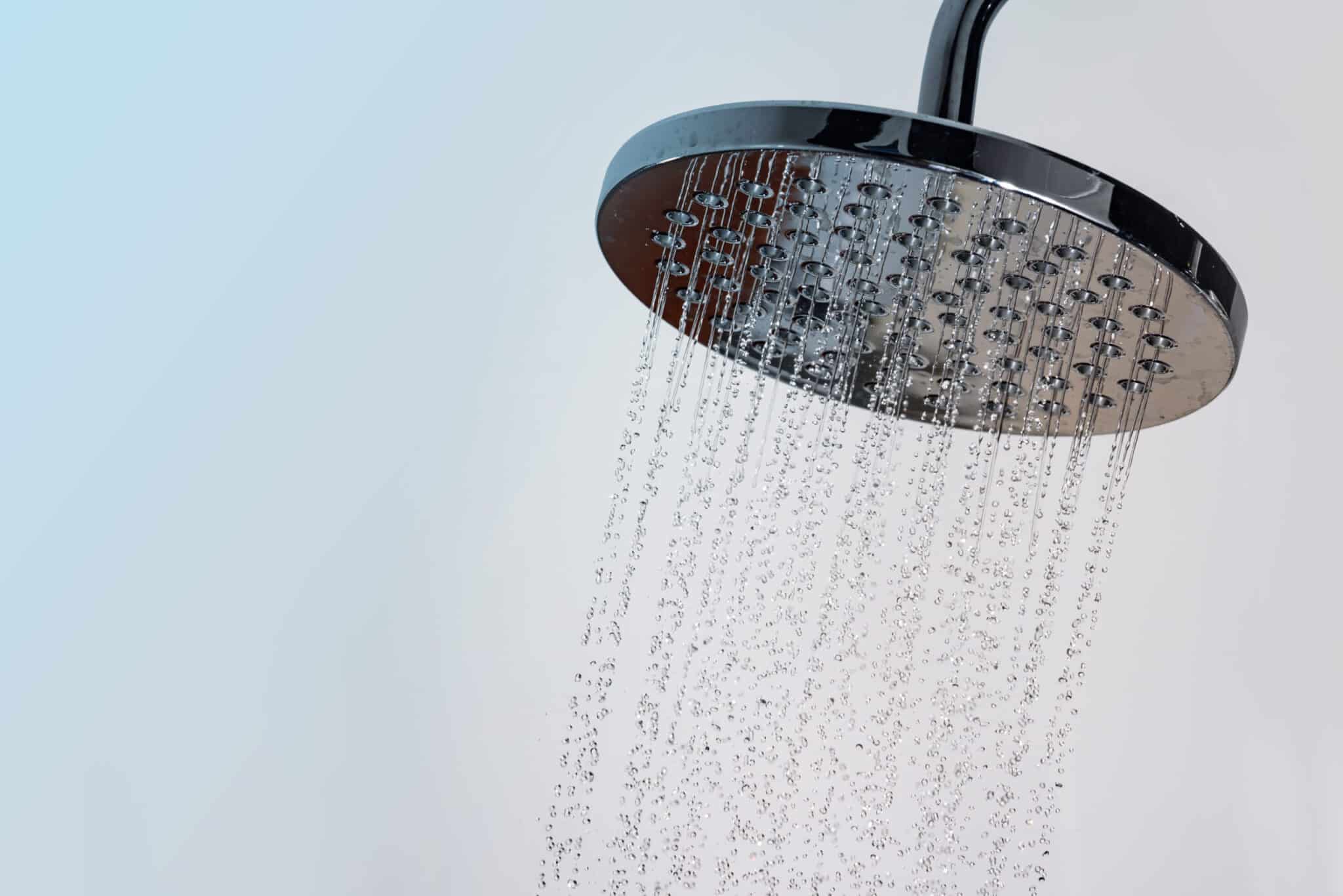 Water pressure from a shower head.