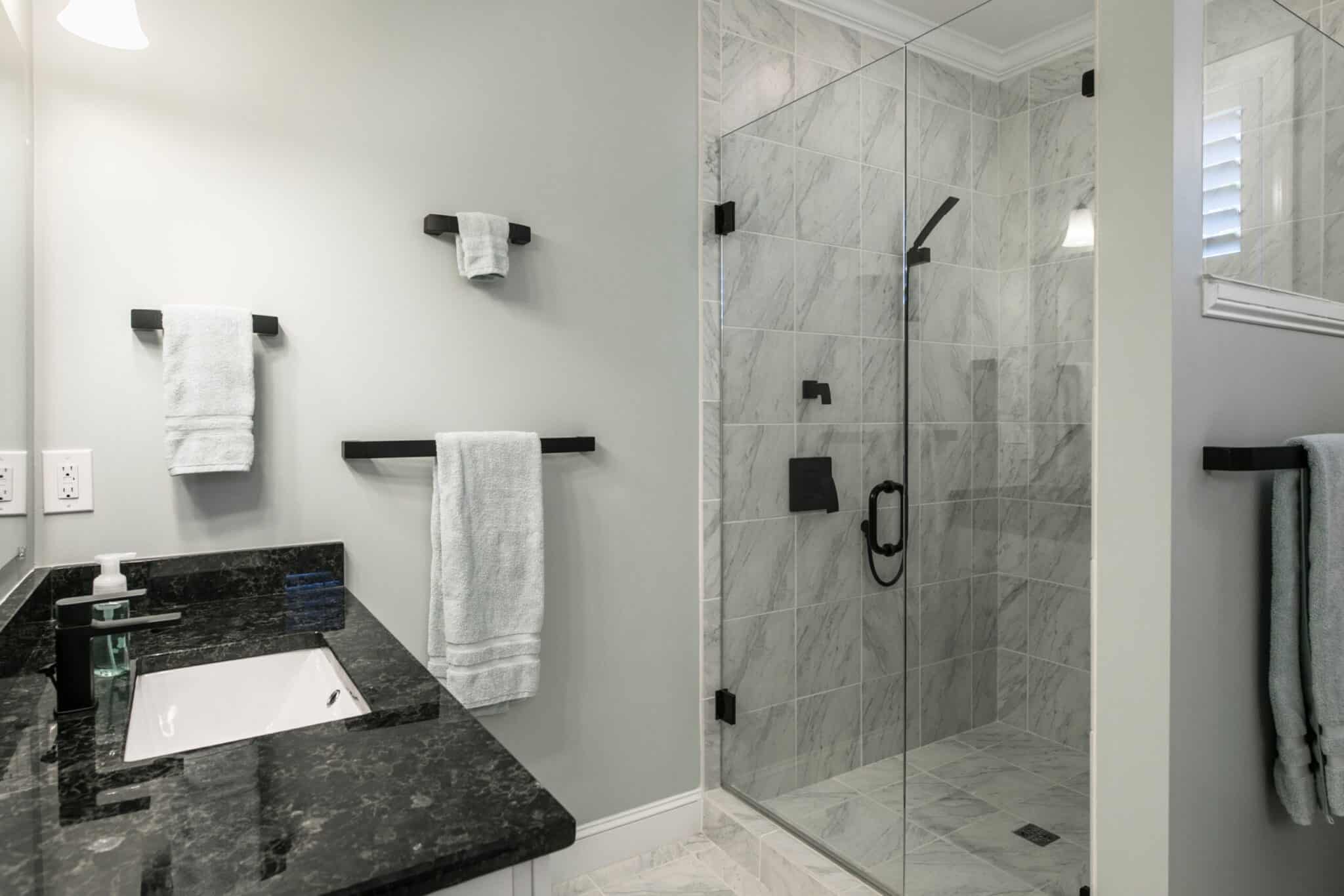 Bathroom remodel using the existing towel hangers.