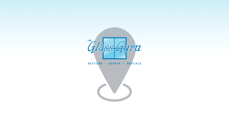 A blue and white logo with the word glassgreen on it.