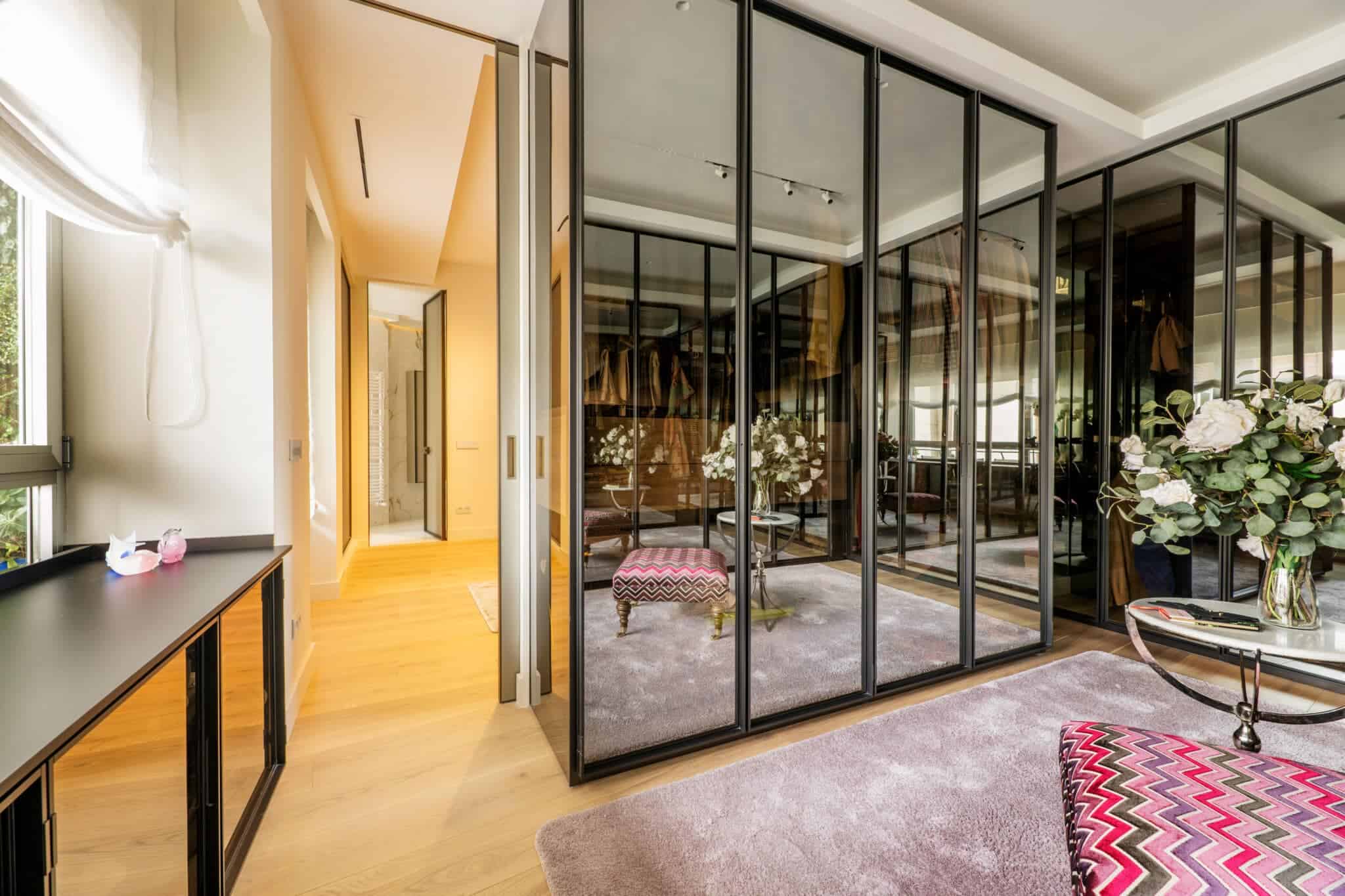 Chic mirrored doors in a massive walk-in closet