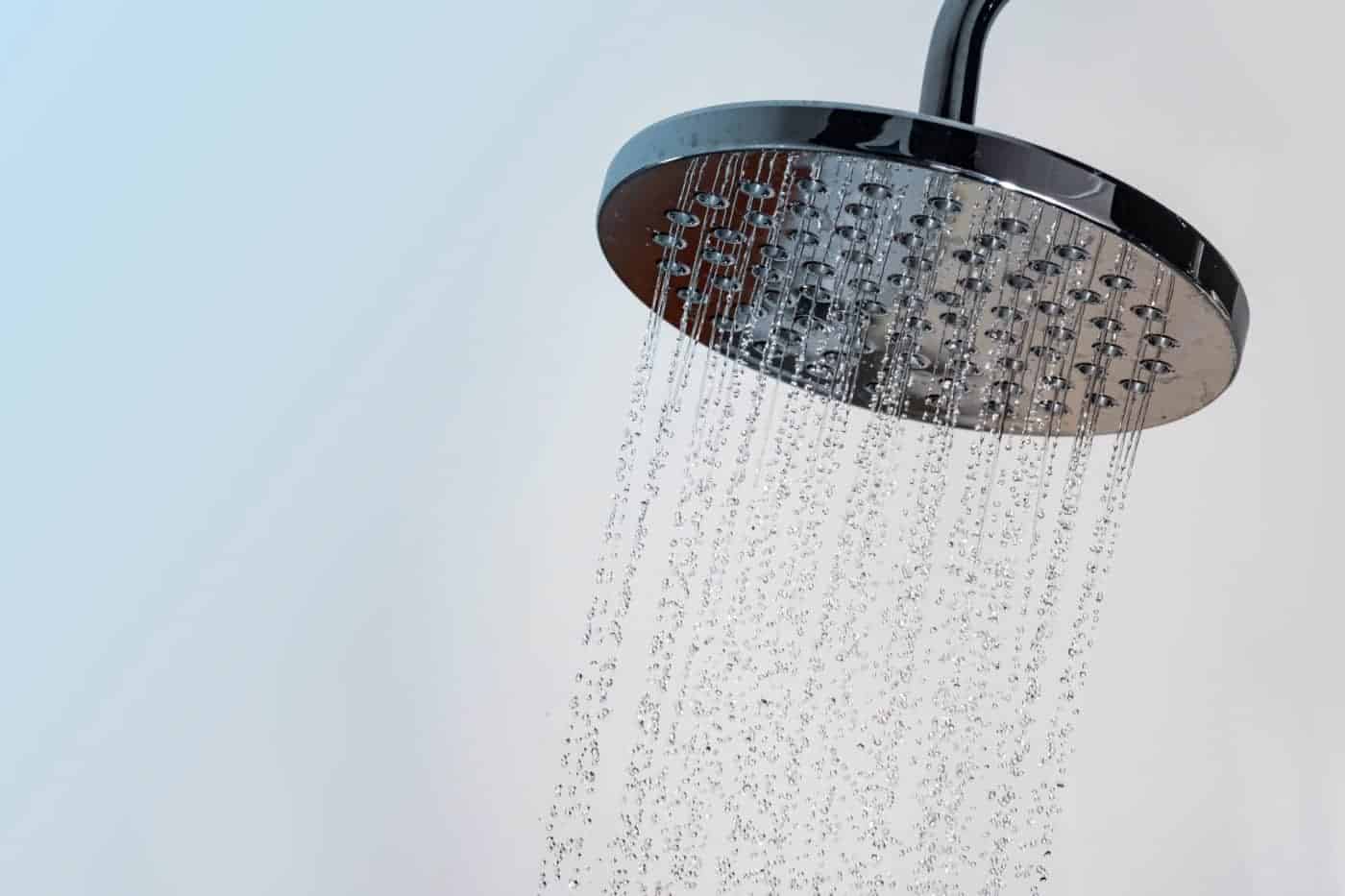 Close up of Water flowing from shower in the bathroom